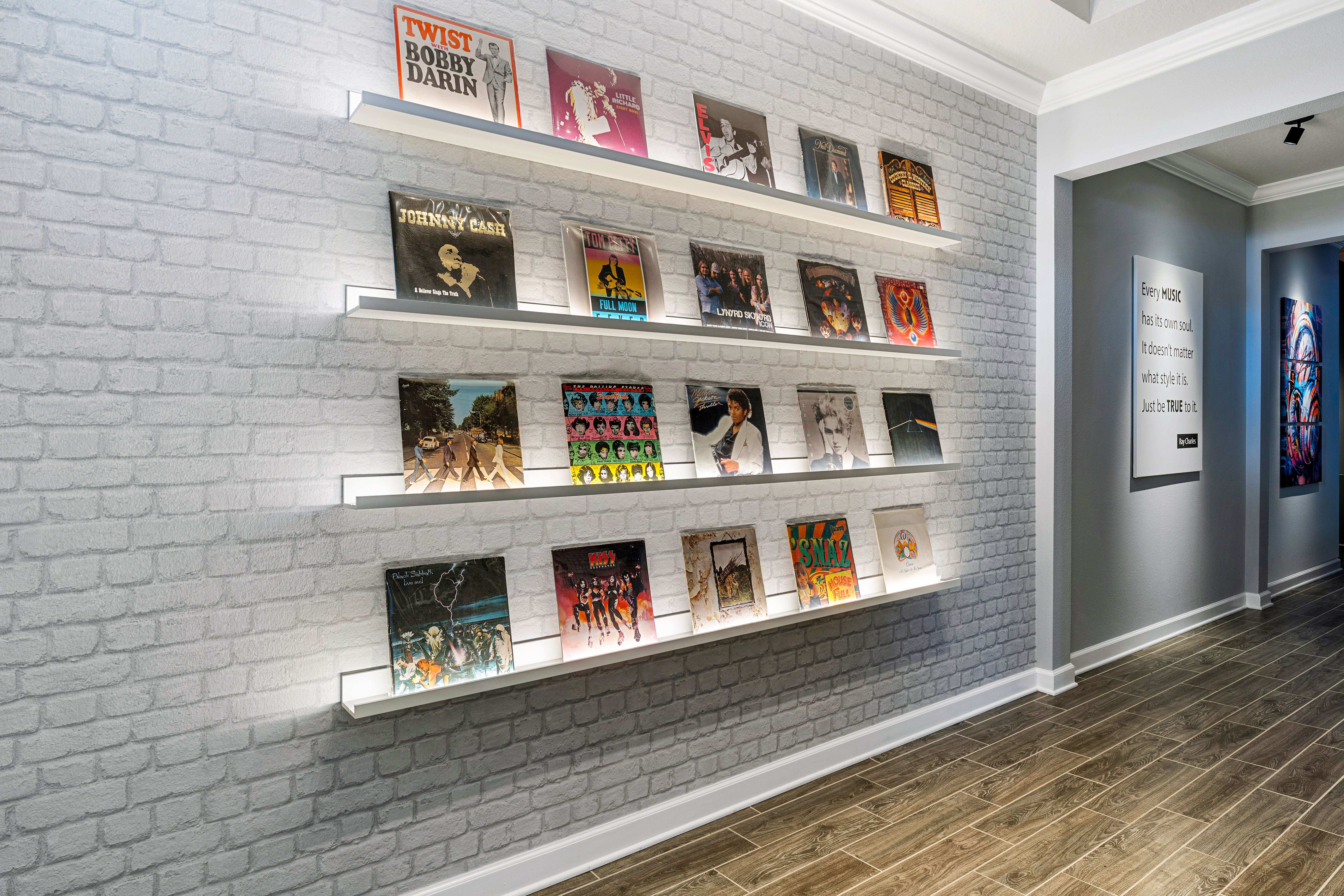 Records displayed on illuminated shelves