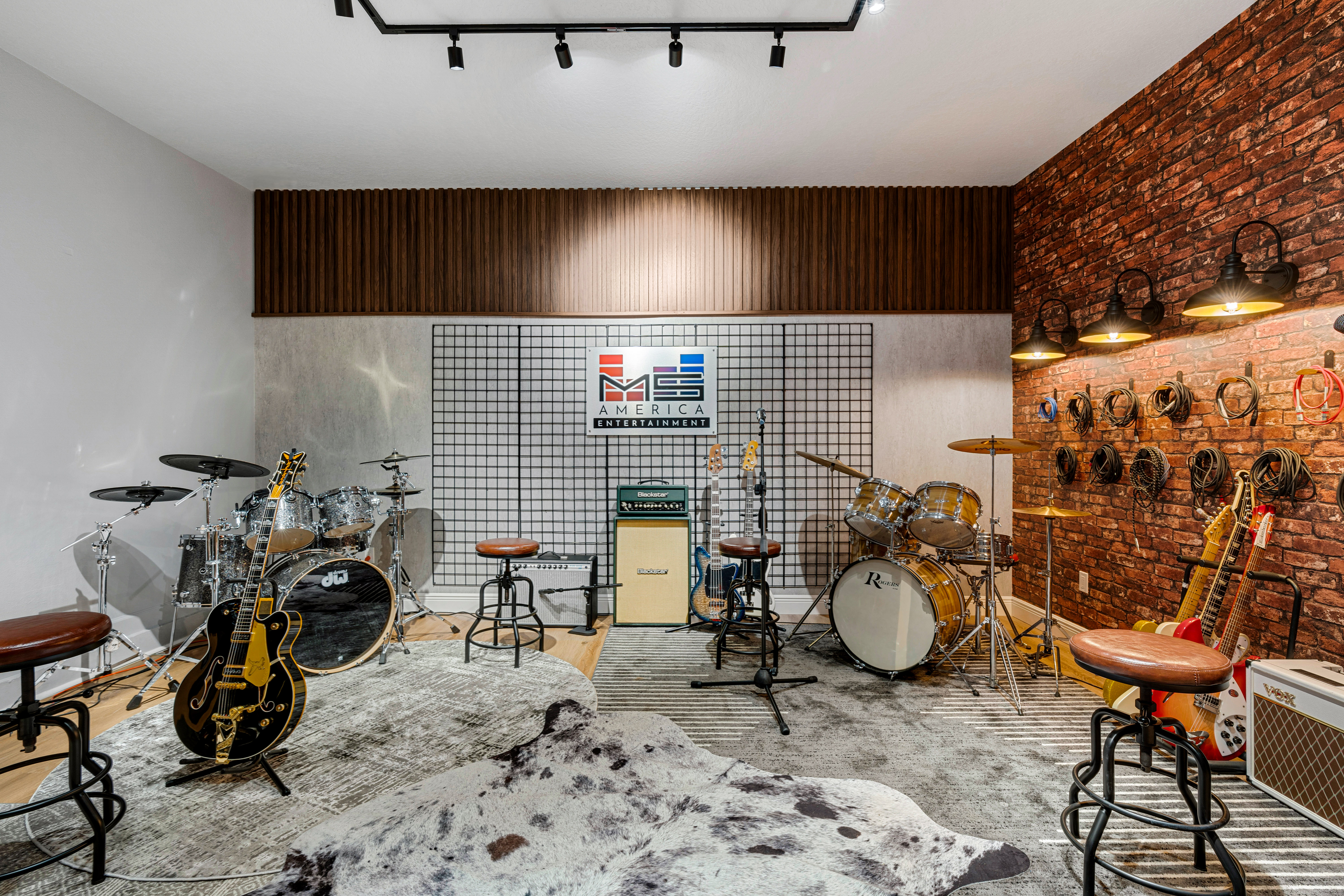Studio with drums, guitars and MS America sign